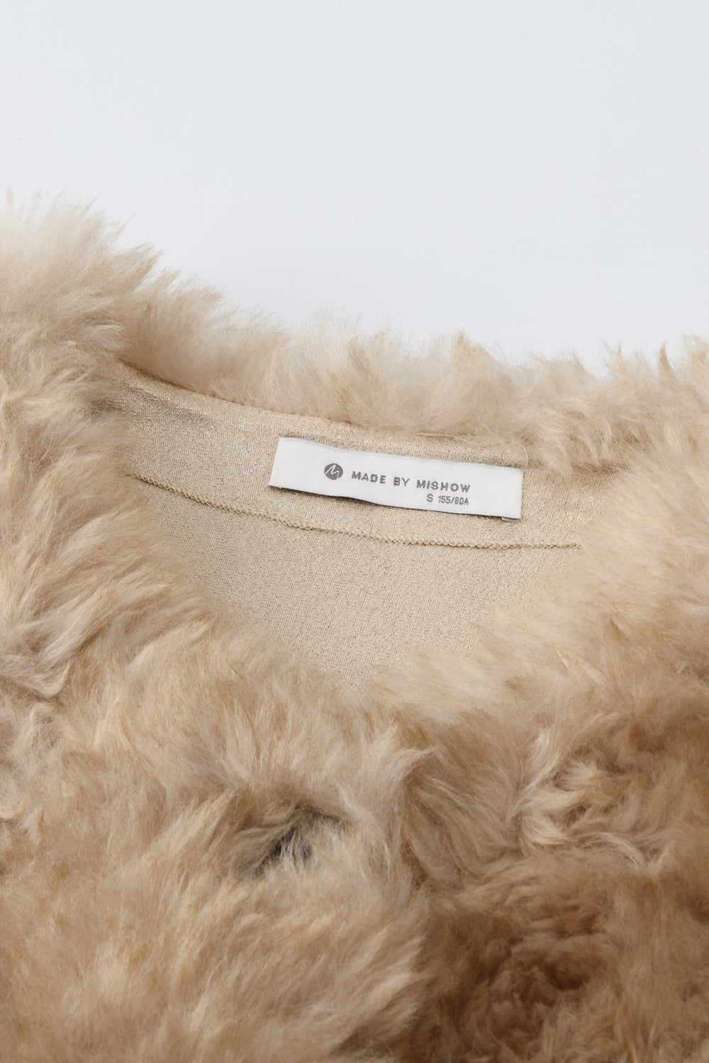 여성용 민소매 코트